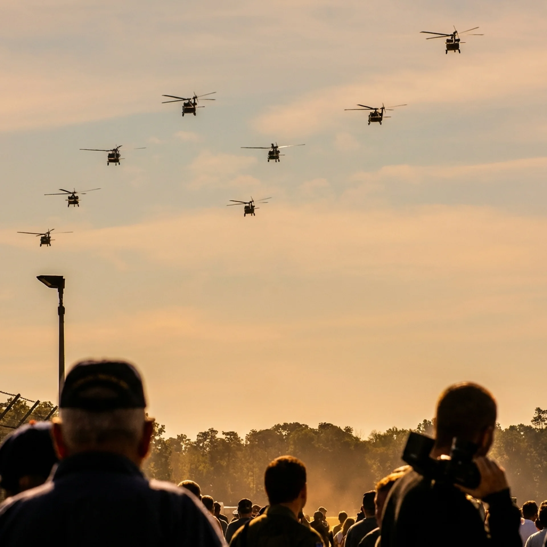 Military helicopters formation at sunset